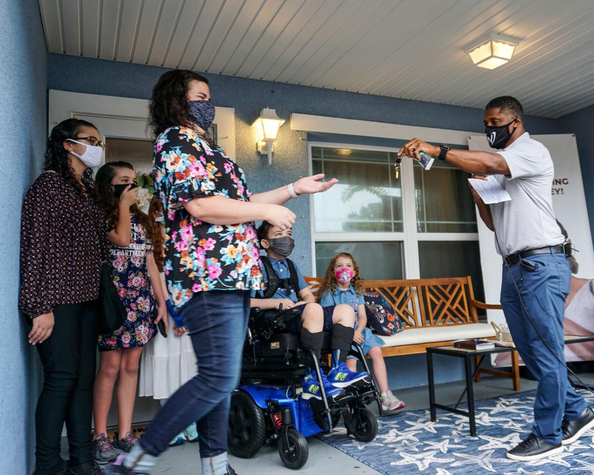 A handoff with heart: Habitat for Humanity, Warrick Dunn, Denard Span team up to set up Largo mother of 6 with home