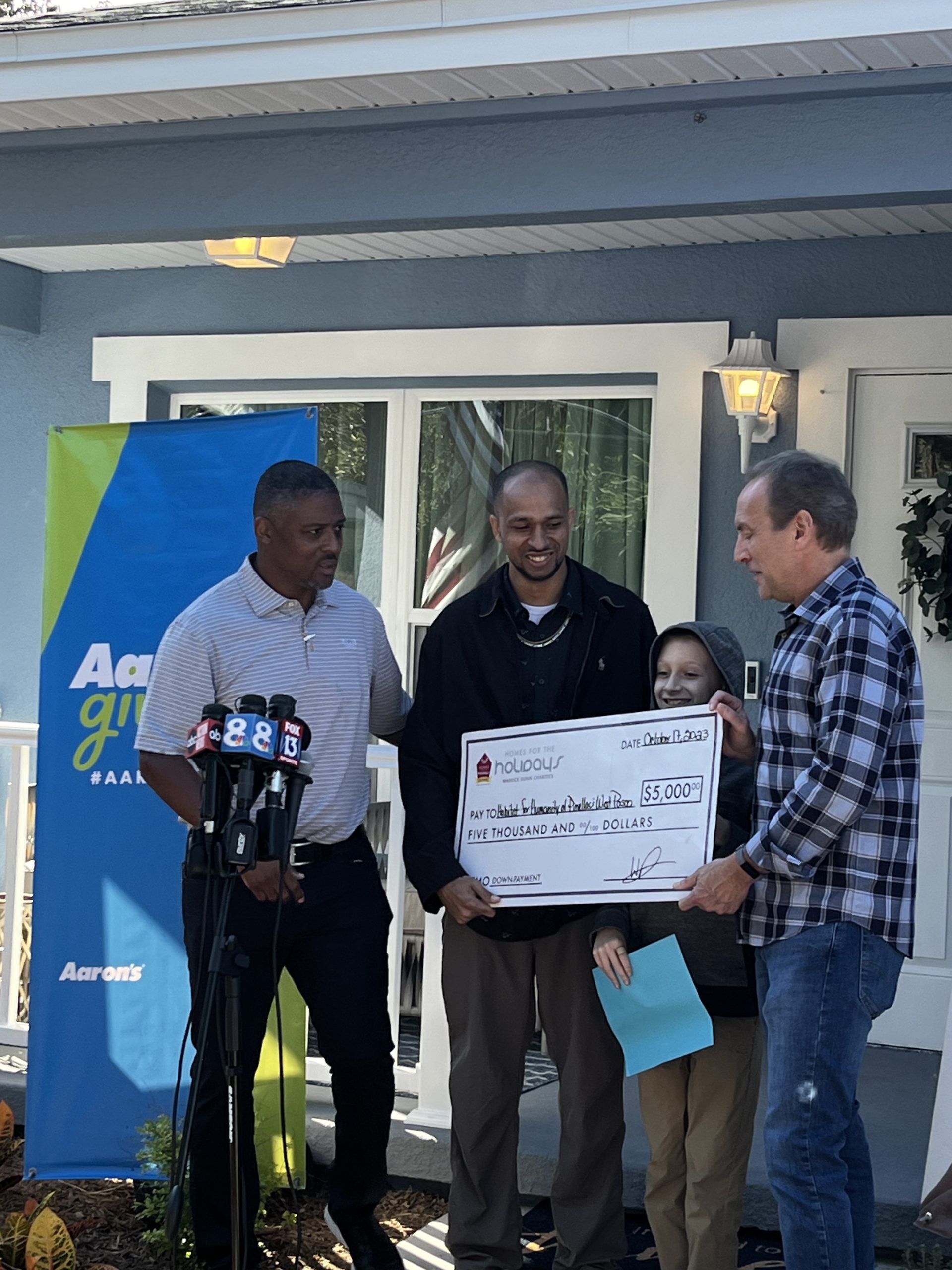 Former Buc Warrick Dunn gives brand new home to single father