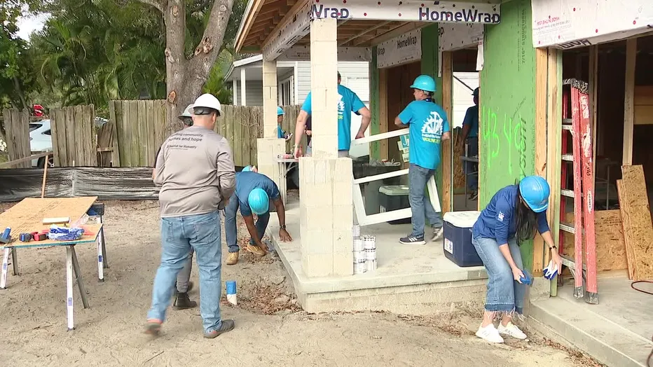 Former Buccaneer Rondé Barber, Bay Area CEO's help build home for Pinellas County school bus driver